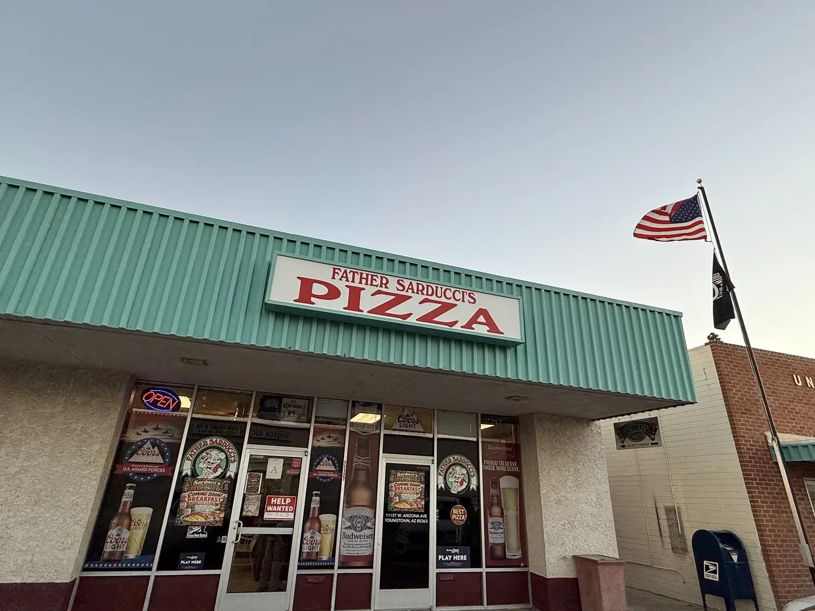 Father Sarducci's storefront with the teal awning
